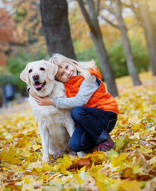 istock Girl and her dog 605770018