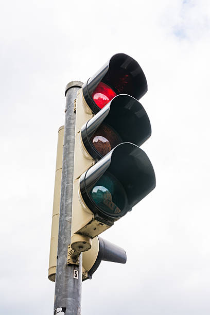 istock Stoplight Traffic Red Glowing Green Yellow Isolated White Background Object 605770110