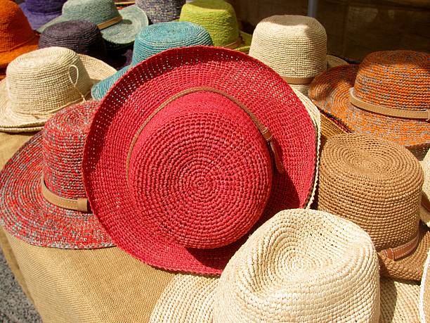 istock Market stall with craftsmanship straw hats 605771826