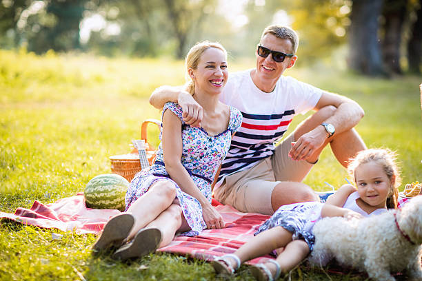 istock Cheerful friendly family is resting in park 605773106