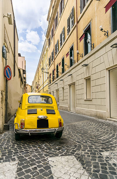 istock Old Yellow Car in Rome 605775444