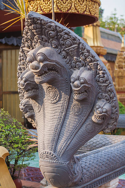 istock Stone carved of five-headed snake as decoration. 605776884