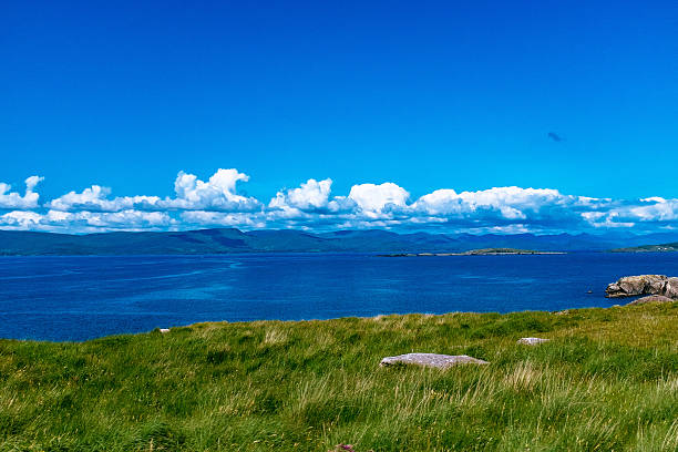 Sea, sky, clouds, reflection of light.\nDramatic landscape.
