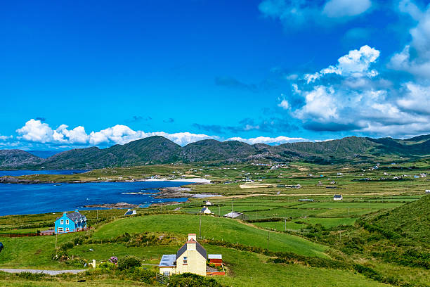 istock Scenic View Of Coastline By Mountains Against Sky 605777897