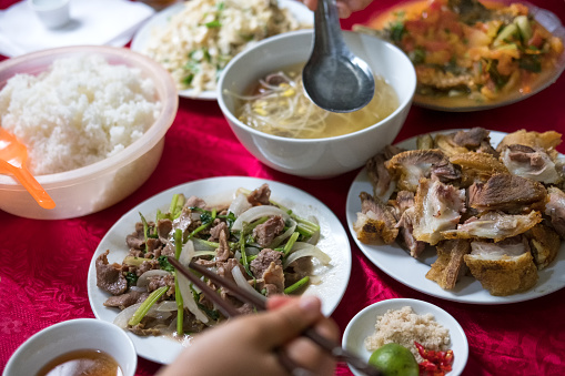 Regional Food:  A typical and traditional multi-course dinner or lunch in North Vietnam with fish sauce, salt, limes and peppers on the side.