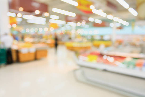 supermarché fond avec flou bokeh - supermarché photos et images de collection