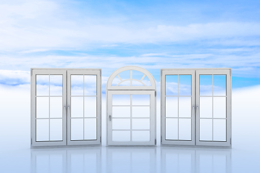 White windows with blue sky and clouds on the background