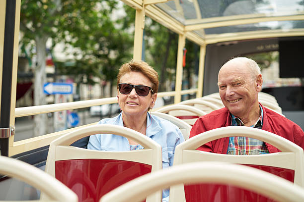 istock couple on sightseeing bus tour 605779546