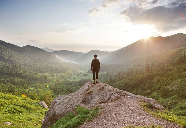 istock Traveler staring at the mountains. 605781058