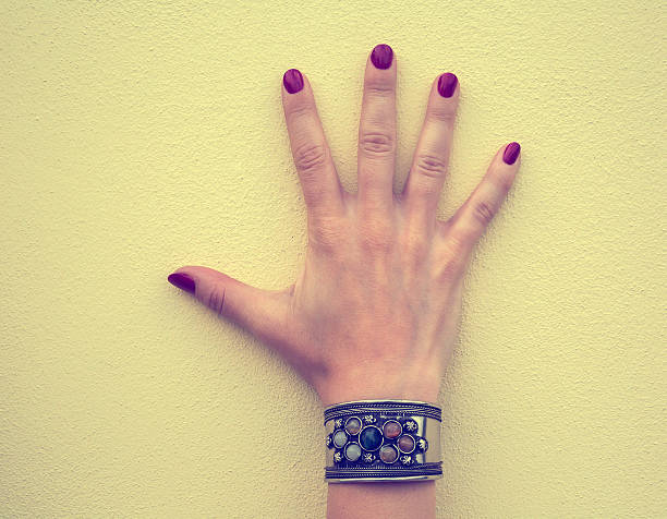 istock Women's bracelet on the wrist 605781232