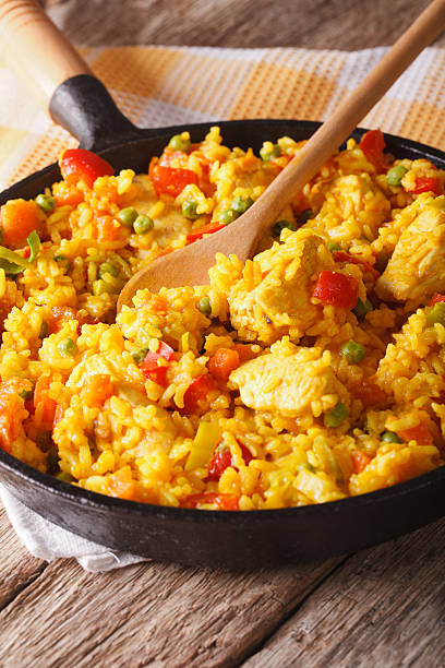 istock Hispanic rice with chicken and vegetables close-up in a pan 605783684