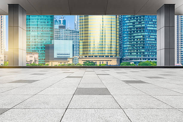 istock abstract architectural column with city skyline background 605785308