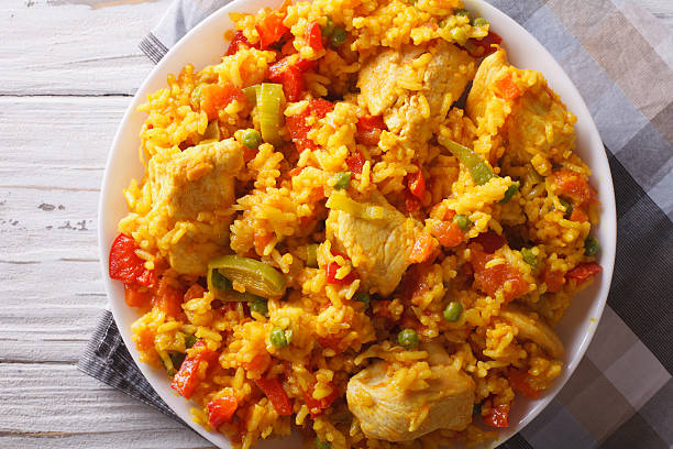 istock Rice with chicken and vegetables closeup. horizontal top view 605786530