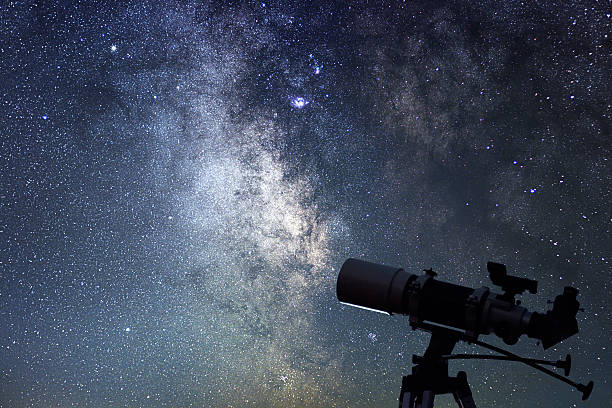 istock Telescope in starry night. Milky way and telescope. Astronomy 605787690