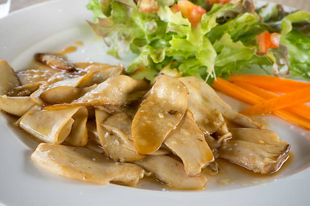 istock Roast mushroom with sour and vegetables salad. 605788444