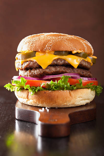 istock double cheese burger with jalapeno tomato onion 605955220