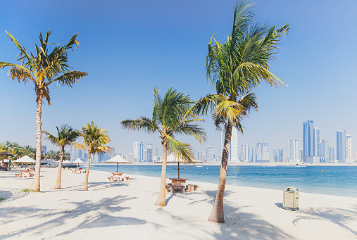 City view from Al Mamzar Beach Park in Dubai, UAE .Al Mamzar is located in the area of Deira, in the north-east of Dubai. The locality is bordered by the Persian Gulf to the north, Al Waheda to the west, Hor Al Anz to the south and the emirate of Sharjah to the east.