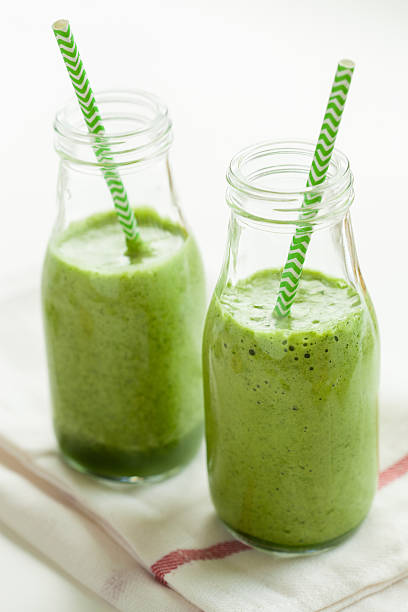 istock healthy green spinach smoothie with cilantro lime banana ginger 605957758