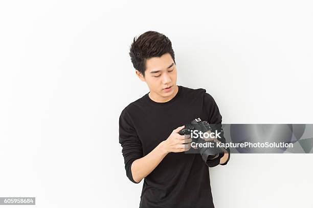 Young Asian Photographer Stock Photo - Download Image Now - Photographer, Asian and Indian Ethnicities, SLR Camera