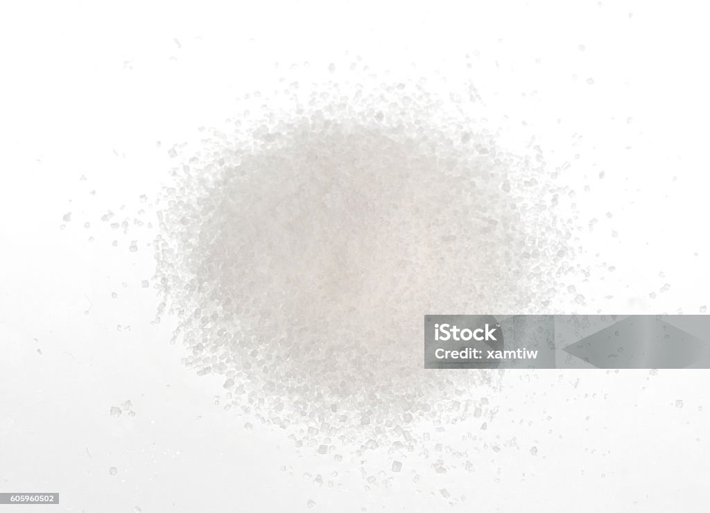 Pile of sugar isolated on white Close-up of pile of sugar isolated on a yellow background Sugar - Food Stock Photo