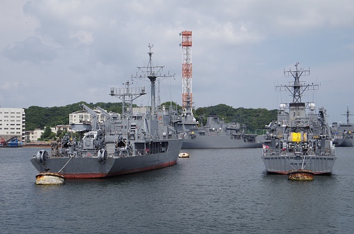 Kanagawa, JAPAN - August 18, 2016 : A photo is two retired battleships in Yokosuka port. Yokosuka Port is naval port. Many of the JMSDF and the US Navy of ships are at anchor.