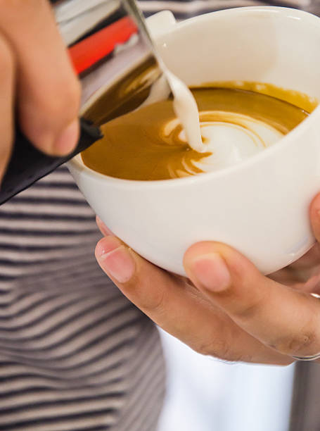 istock Barista making a cup of coffee 605970276