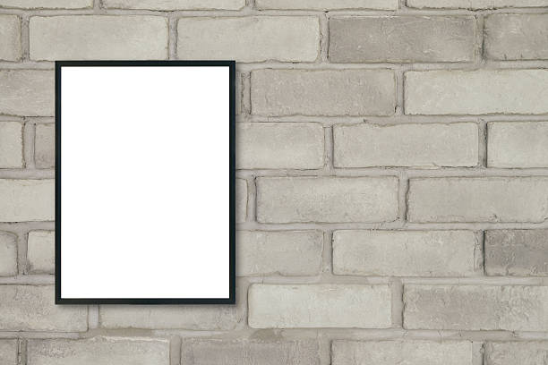 istock Mock up blank poster picture frame on brick wall. 605970698