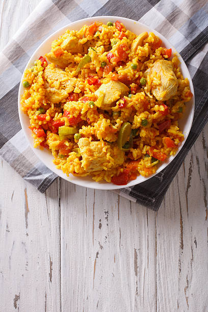 istock Hispanic cuisine: Arroz con pollo closeup in a bowl. vertical 605970768