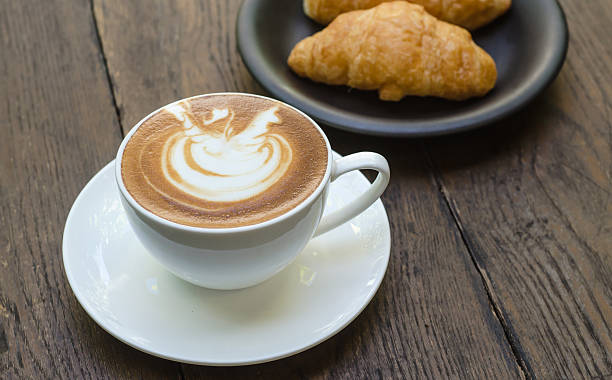 istock Barista making a cup of coffee 605971940