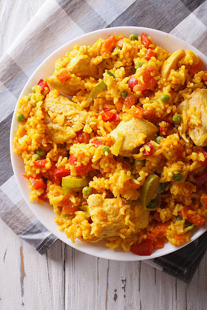 istock Arroz con pollo closeup in a bowl. vertical top view 605972398