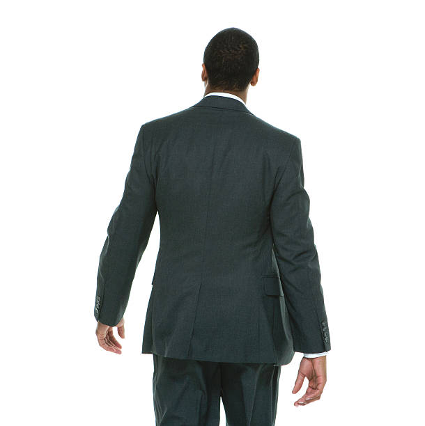 istock Rear view of businessman walking 605973784