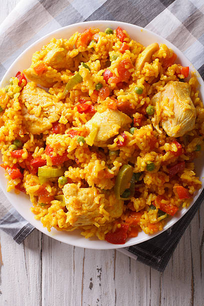 istock Rice with chicken and vegetables closeup in a bowl. vertical 605974124
