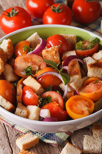 istock Fresh Italian panzanella salad close-up on the table. Vertical 605976680