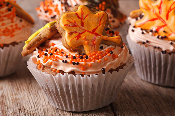 Autumn cupcakes decorated with cream and leaf. horizontal