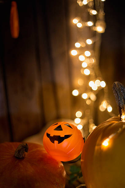istock Halloween pumpkin head jack lantern on wooden background 605981528