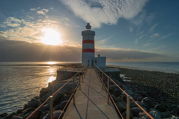 istock Lighthouse at seashore of Iceland, summer time 605982436