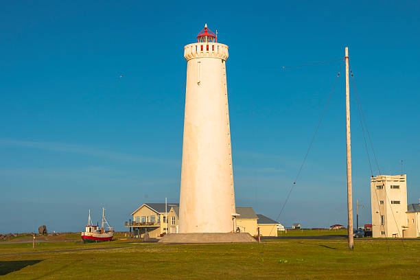 istock Lighthouse at seashore of Iceland, summer time 605982476