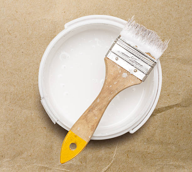 istock Can of white paint with brush 605982748