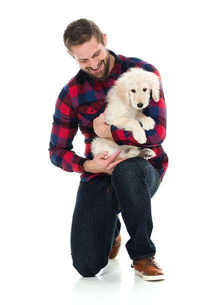 istock Smiling man embracing with his dog 605984930