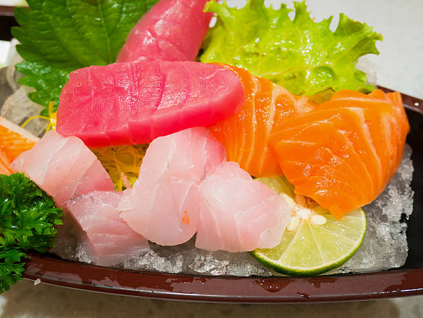 istock fresh salmon fish slice sashimi with tuna sashimi 605985308