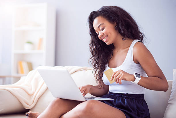 istock Positive woman sitting on the couch 605985974