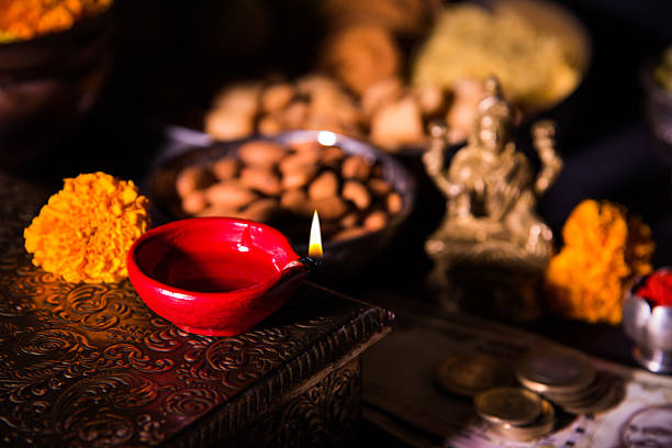 istock typical diwali celebration or puja in india with diya 605986946