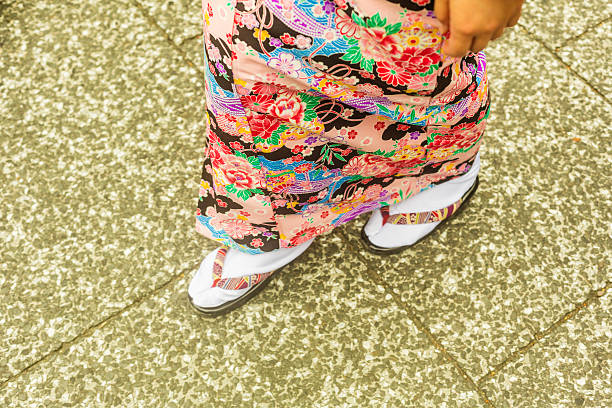 Detail of the Feet of Japanese Women Walking in Kimonos Detail of the feet of Japanese women walking in the street wearing traditional kimonos japan women human foot japanese culture stock pictures, royalty-free photos & images
