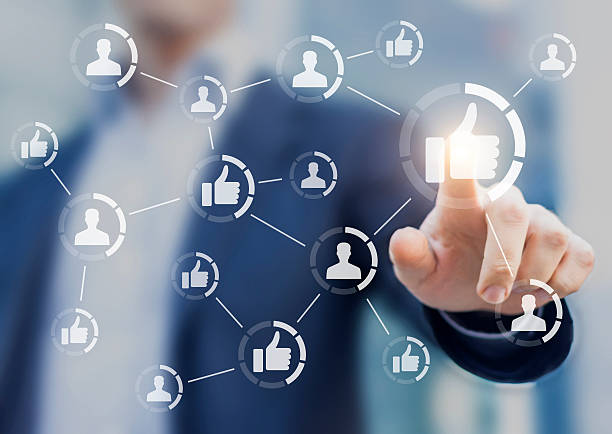 istock Person touching like buttons. Concept about social media network 605987262