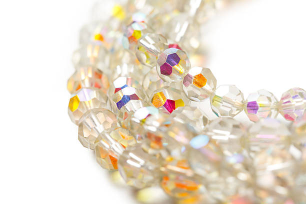 istock Shiny glass necklace on white background 605987986