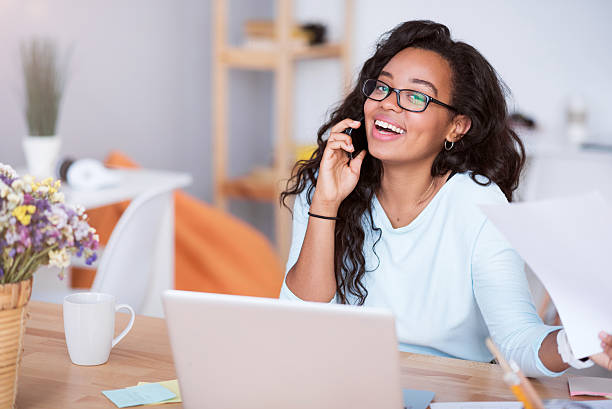 istock Joyful smiling woman talking on cell phone 605988148