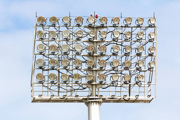 стадион пятно освещения башни - floodlight blue sky day стоковые фото и изображения