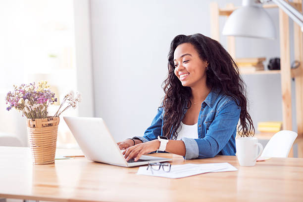 istock Positive woman sitting at the table 605988932