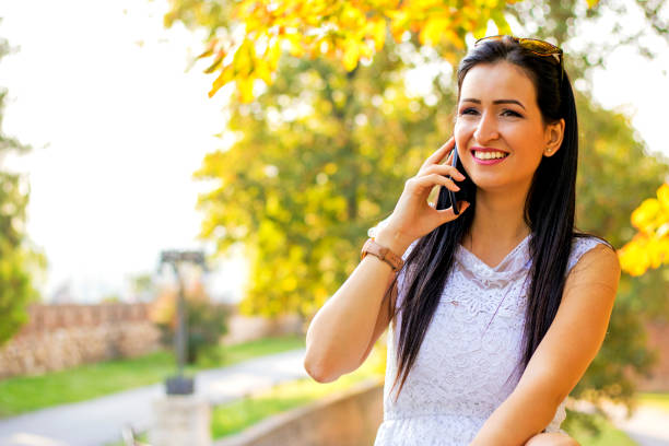 istock Photo of woman using smartphone 605989714