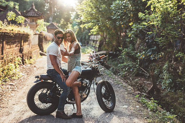 istock Loving young couple taking a selfie with motorcycle 605990142